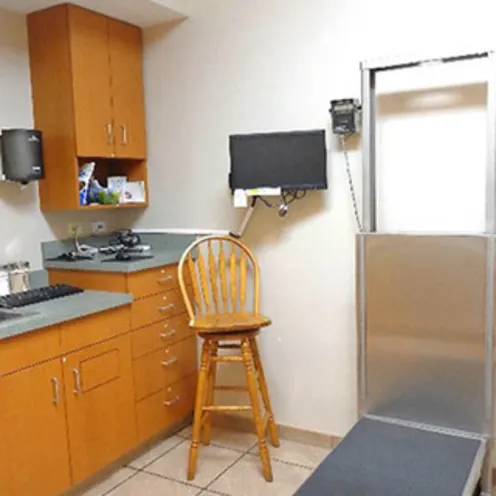Valley Animal Hospital exam room with stool, sink area, and weight scale